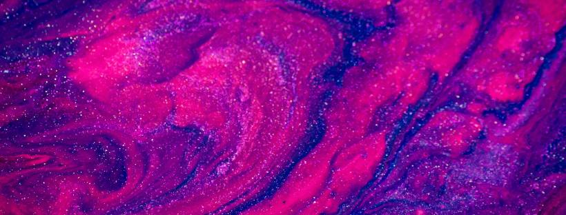 Photo of a purple and pink glittery mess of paint, resembling something celestial.
