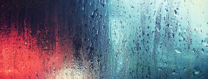 Photo of glass streaked with rain