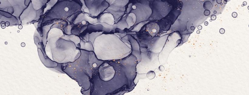 Photo of black alcohol ink with gold splatters on watercolor paper.