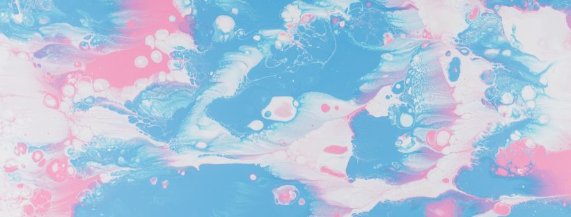 Photo of messy pink, blue and white paint on canvas.