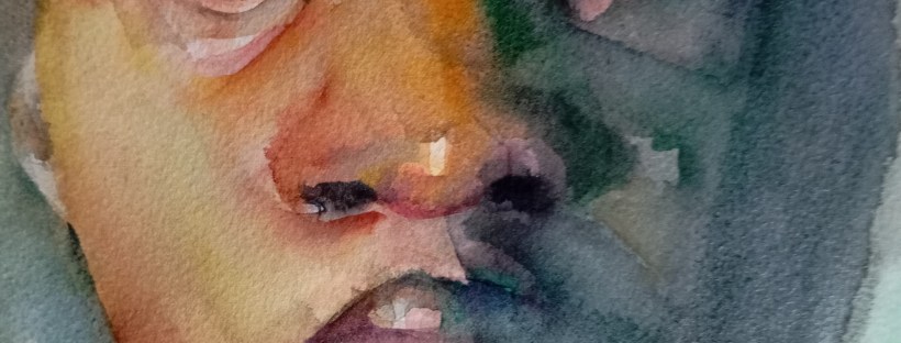 A watercolour painting of a young person with dark skin, shown from the shoulders up. The face is bathed in a spectrum of warm and cool colours - orange, green, and blue.