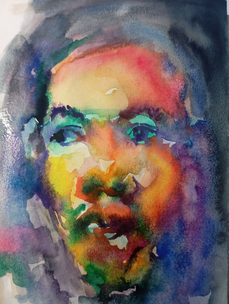 A watercolour portrait of a person's face, blending hues of red, yellow, green, blue, and purple.