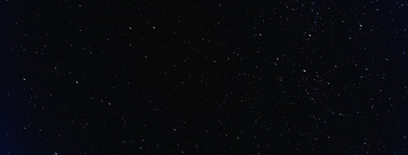 Photo of a dark night sky sparkling with stars.
